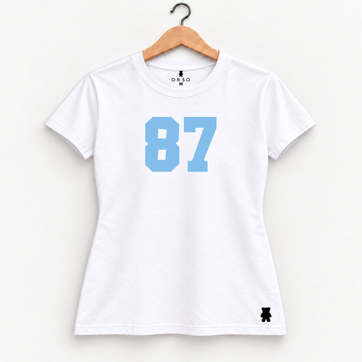 Orso 87 — feminina, camiseta branca, número azul-claro